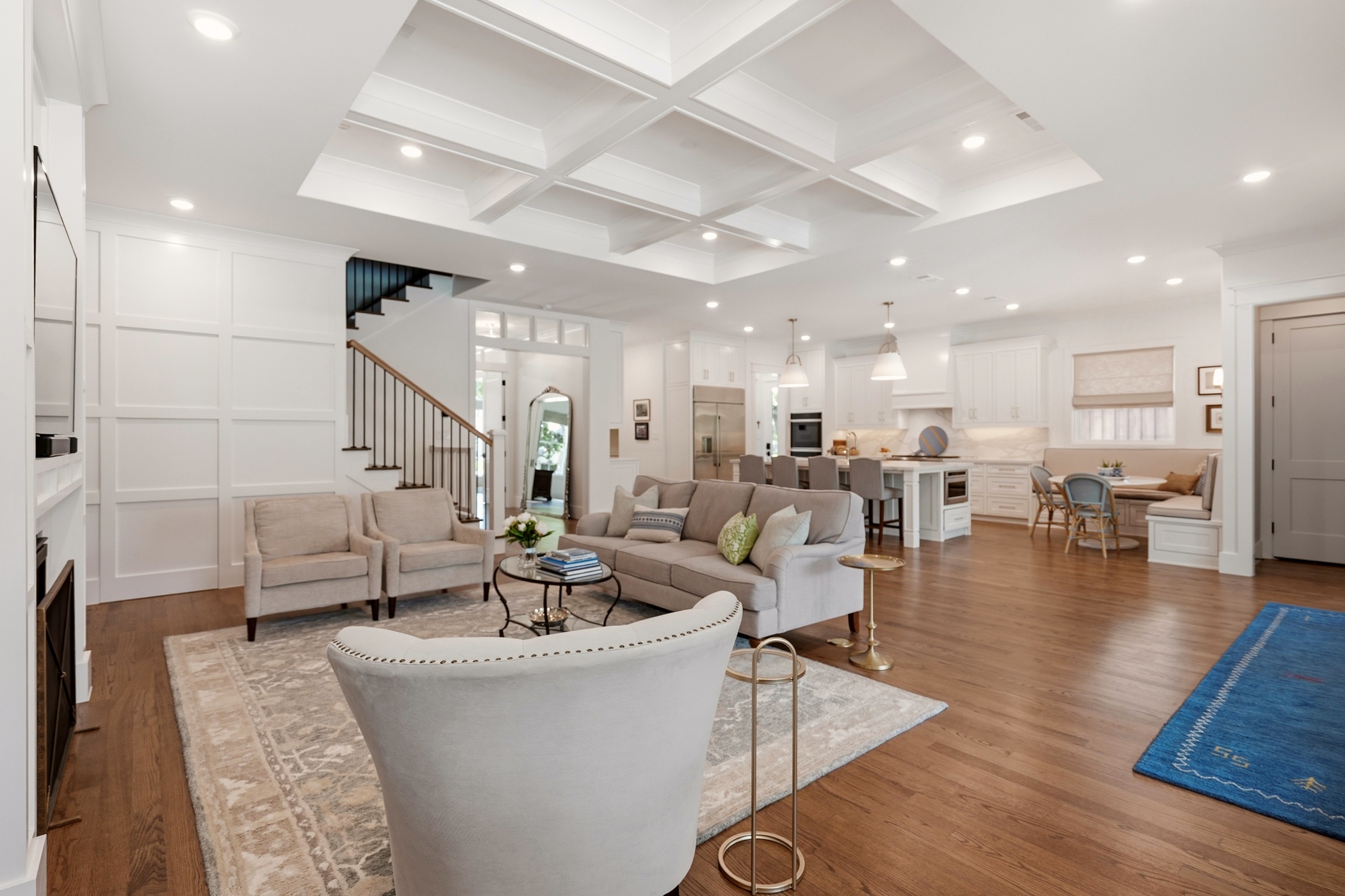 Open-concept great room with coffered ceiling